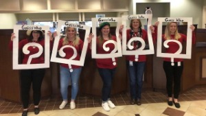 Bank employees dressed up as the game Guess Who?
